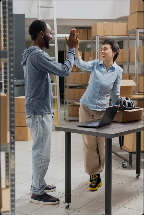 Logistics team celebrating a shipment workflow