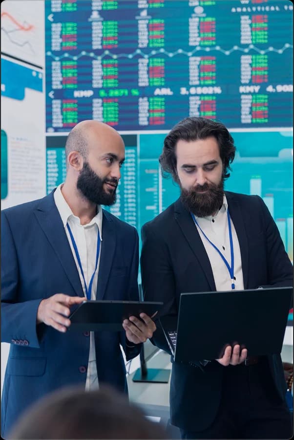 Trading professionals reviewing market and billing records